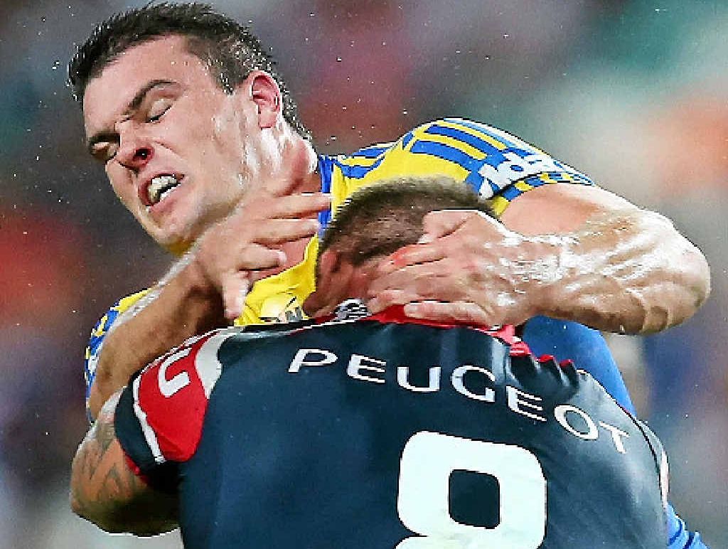 WORTH THE SEASON: Rooster Jared Waerea-Hargreaves receives a high shot from Parramatta’s Darcy Lussick at Allianz Stadium. WORTH THE SEASON: Rooster Jared Waerea-Hargreaves receives a high shot from Parramatta’s Darcy Lussick at Allianz Stadium.